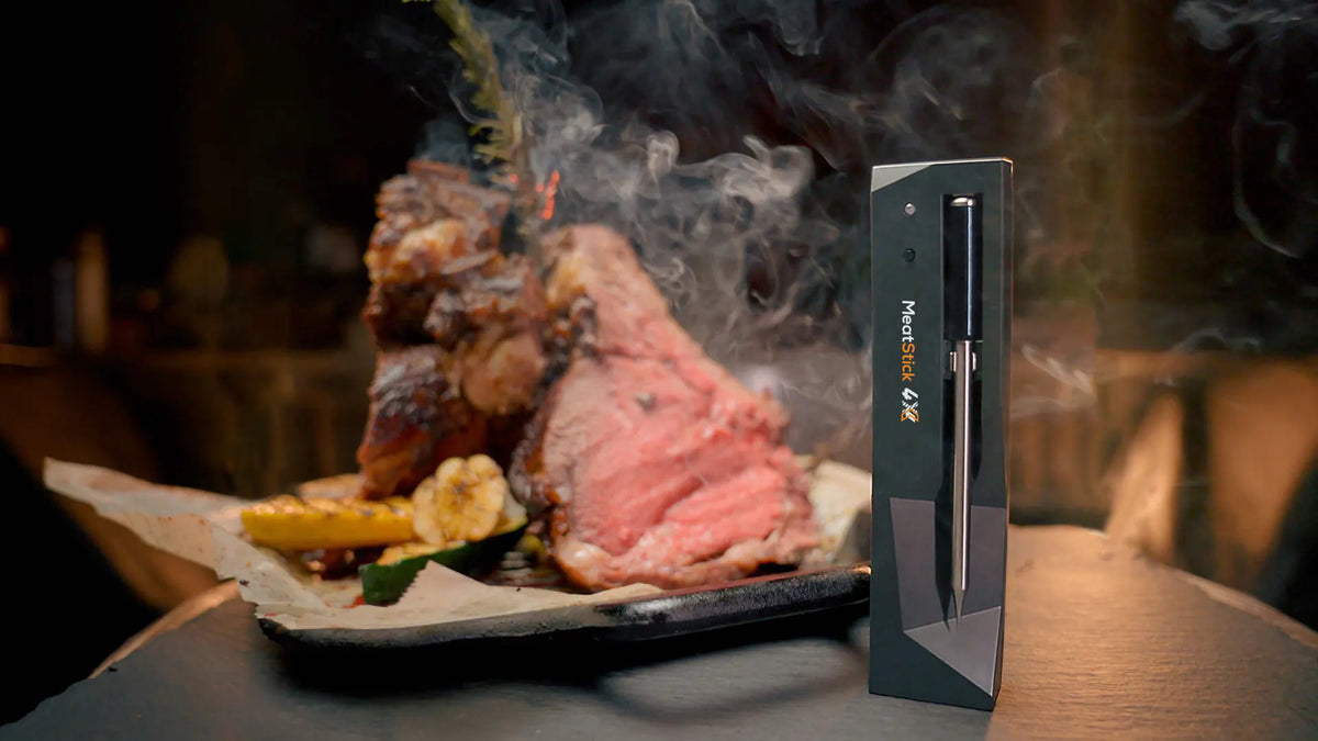 Perfectly grilled prime rib with a MeatStick thermometer inserted for monitoring temperature.
