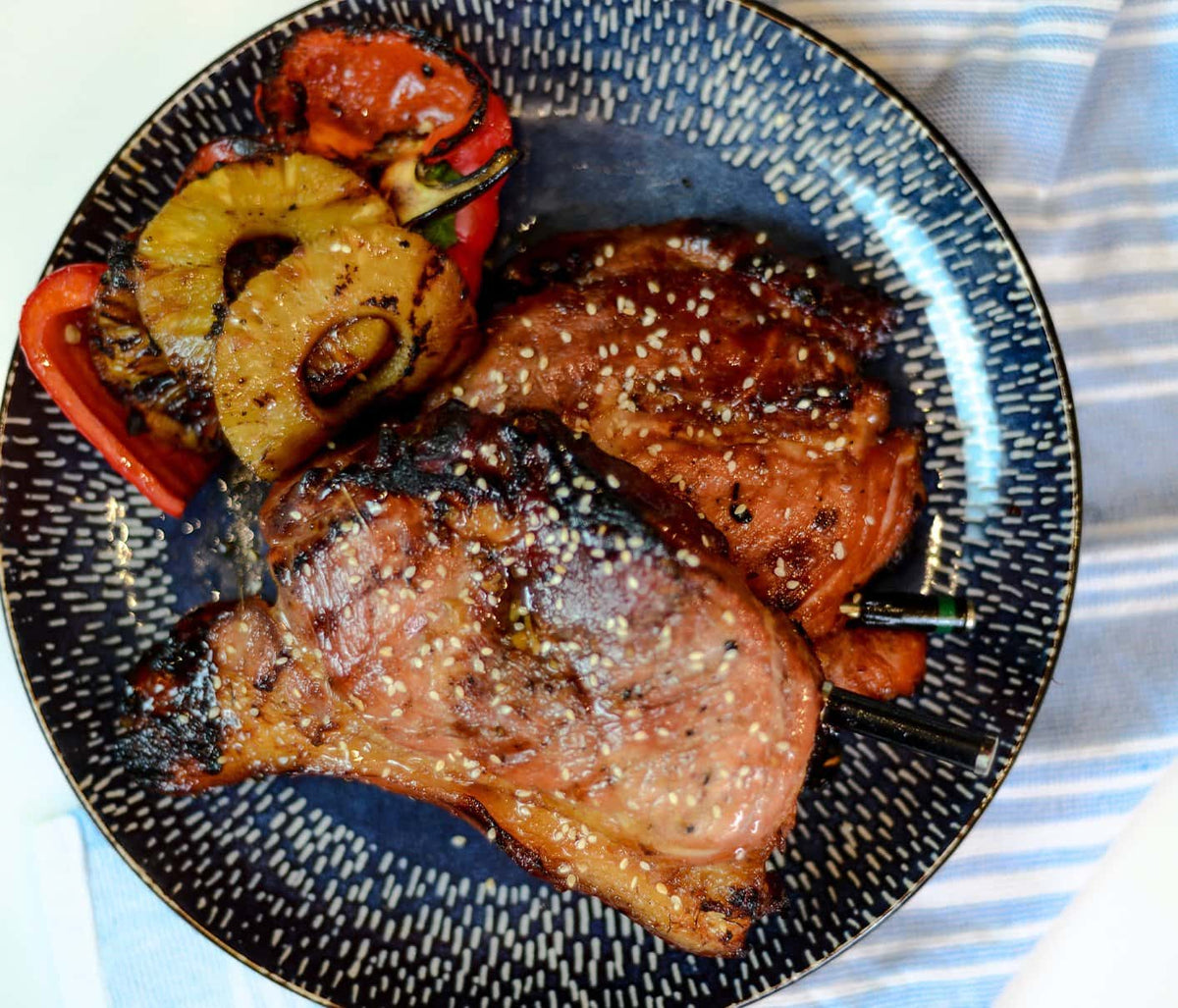 Grilled Teriyaki Pork Chops, grilled Pineapple and Peppers with The MeatStick on a Plate