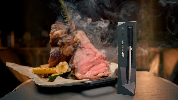 Perfectly grilled prime rib with a MeatStick thermometer inserted for monitoring temperature.